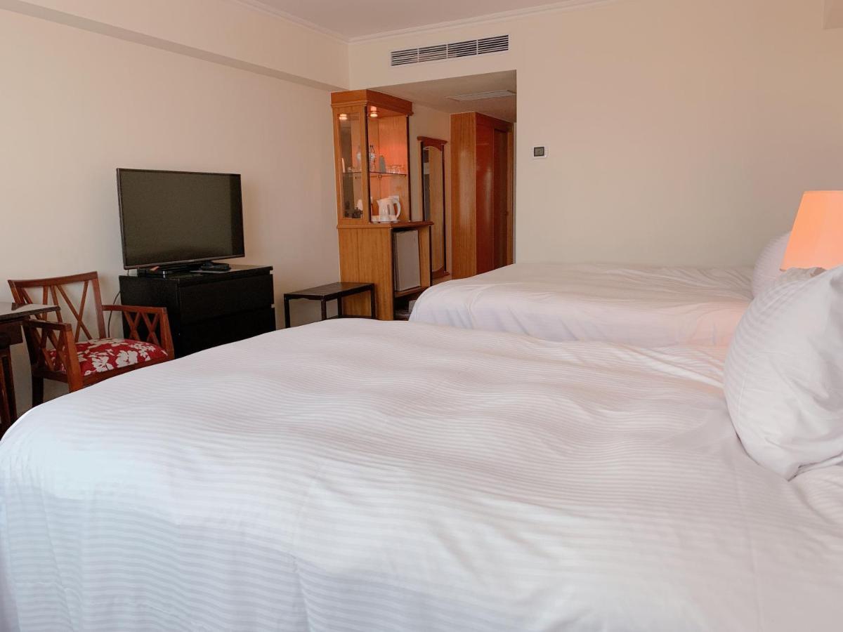 The Howard Plaza Hotel Kaohsiung Exterior foto A room at the hotel